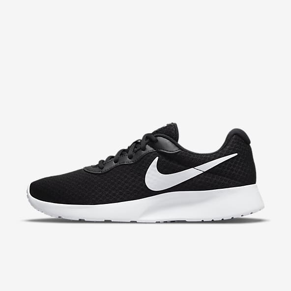 Nike black shoes with white sole best sale